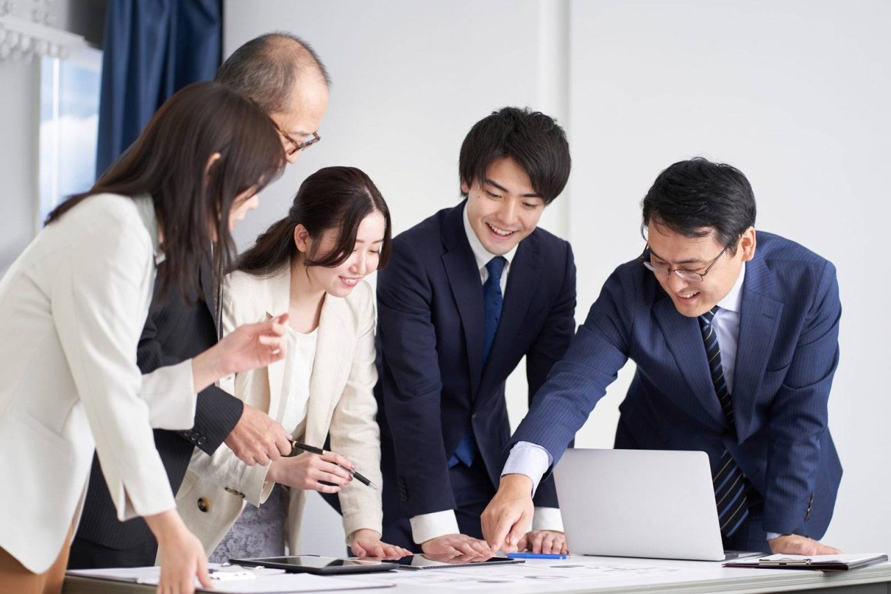 Asian business person explaining at a meeting